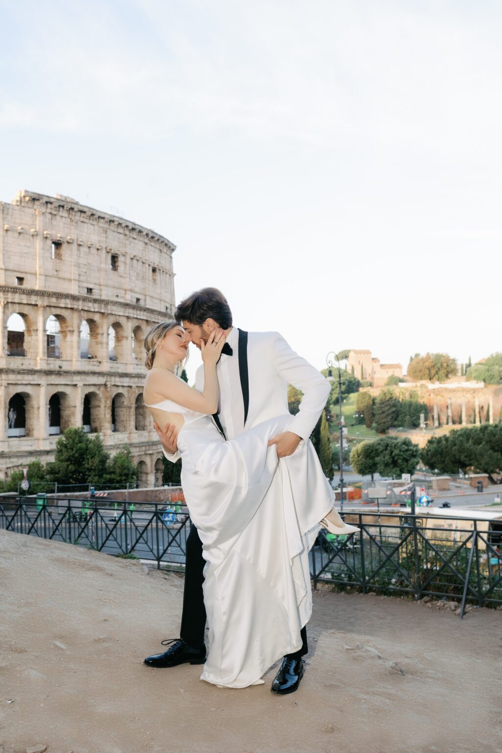 Elopement couple dancing by the Colosseum