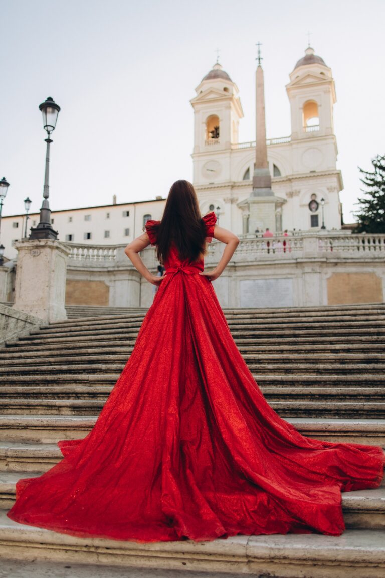 Red flying dress on the Spanish Steps facing Trinità dei Monti