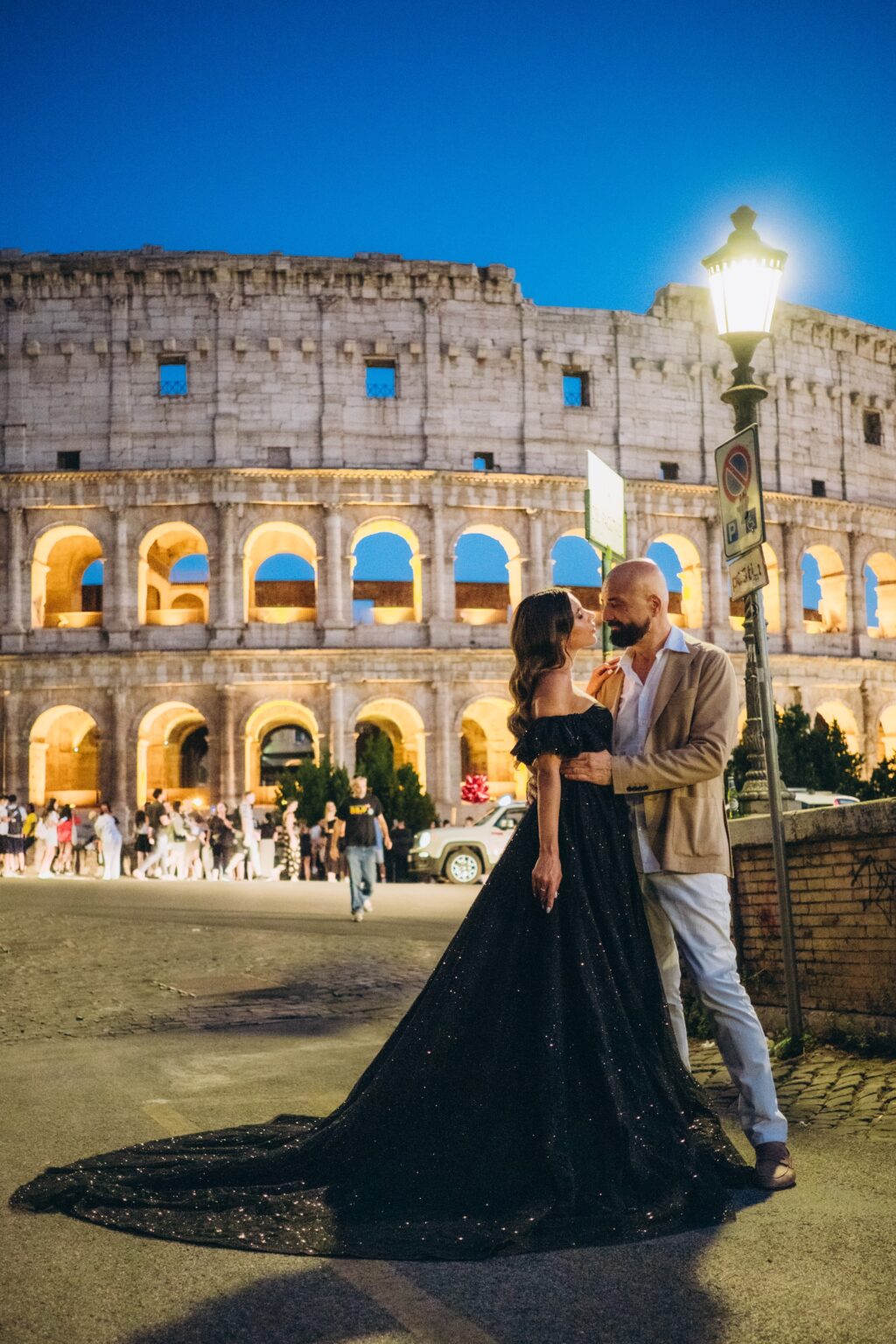 Couple at the Colosseum at blue hour