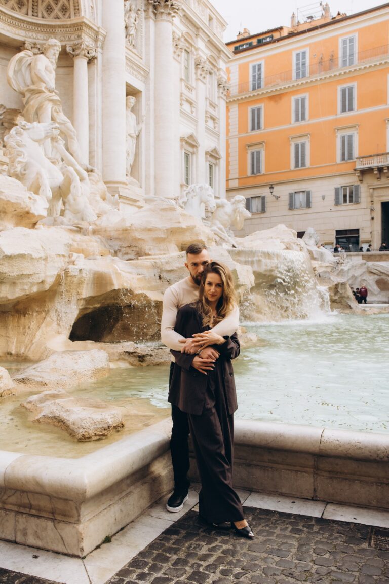 Couple at the Trevi Fountain on a grey March morning