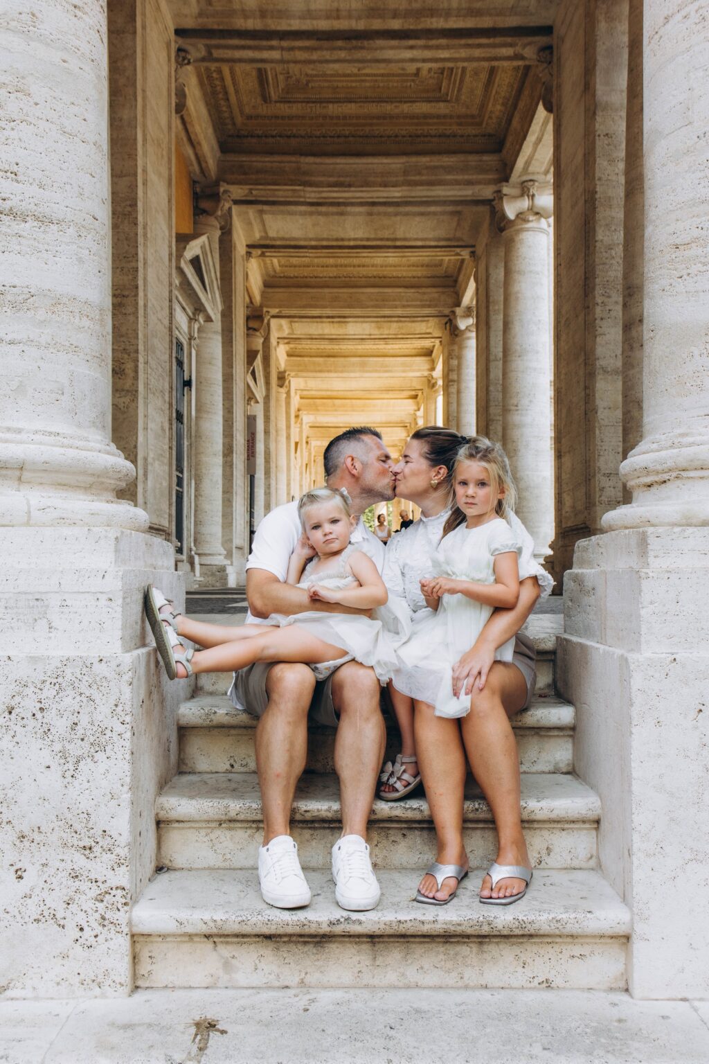 Family of four sitting in the Capitoline arcade