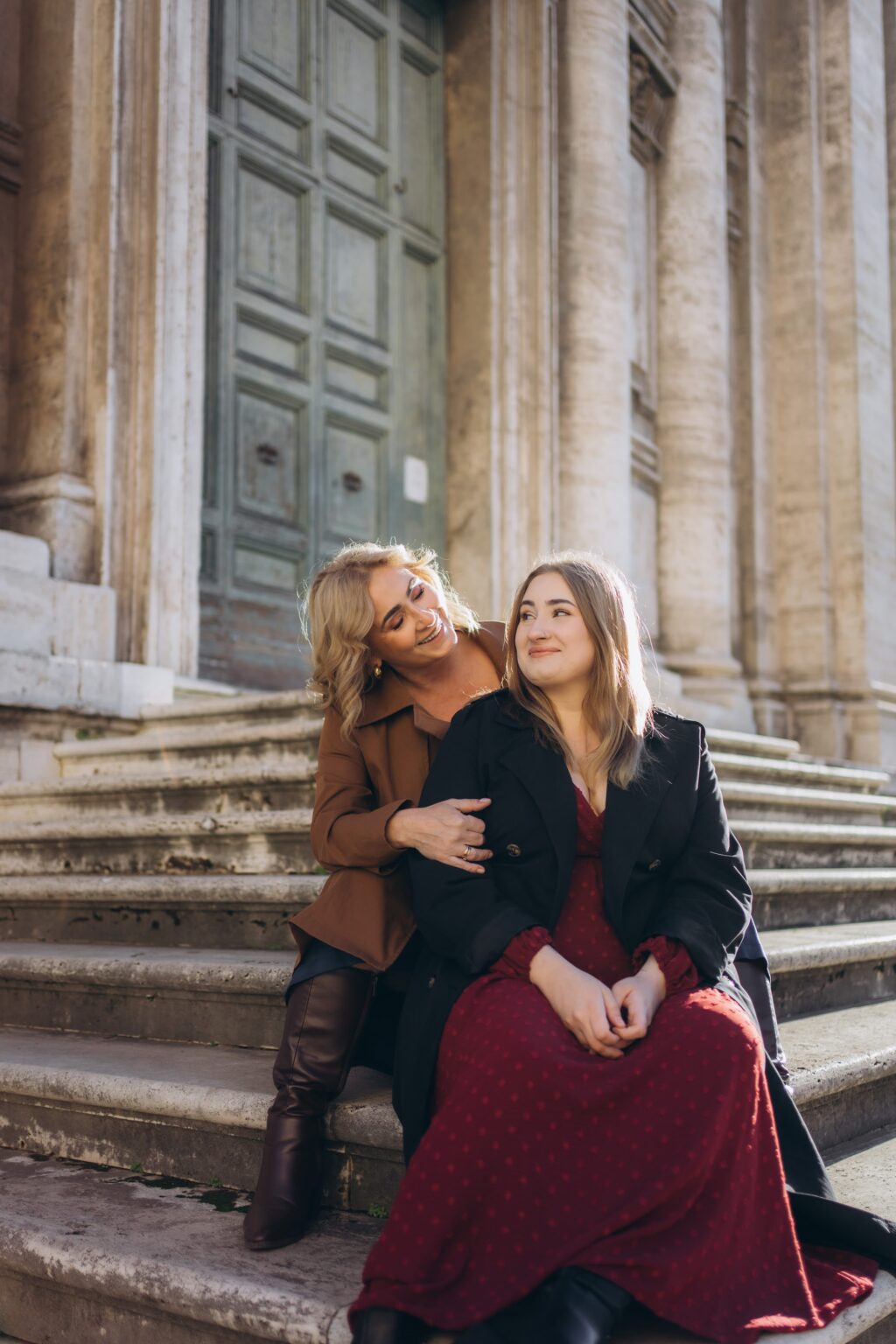 Mother and daughter on church steps in Rome