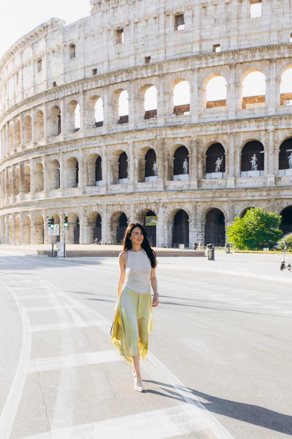 Walking down the empty road beside the Colosseum at 7:40 on a June morning