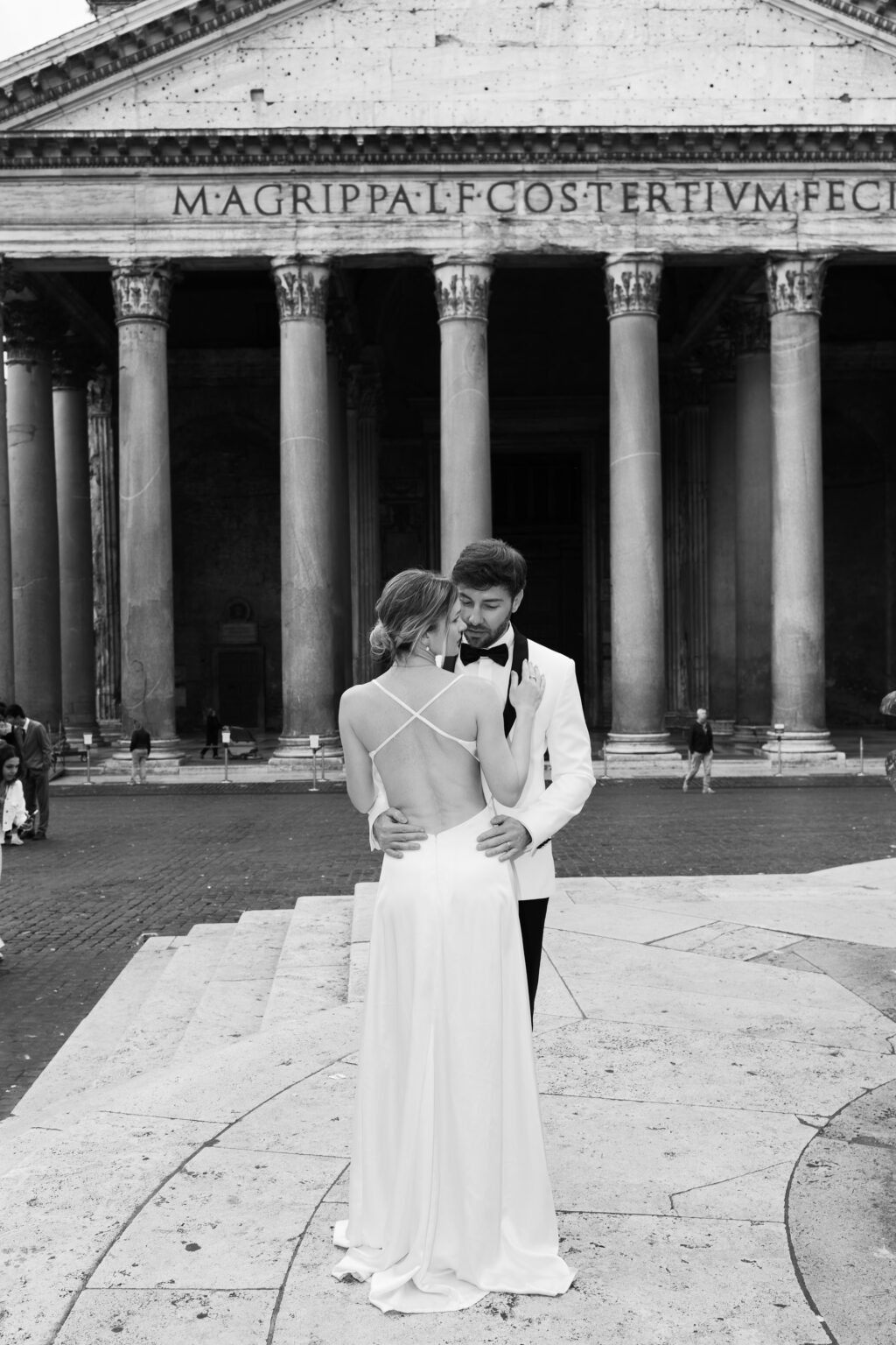 Couple facing the Pantheon portico at 9am