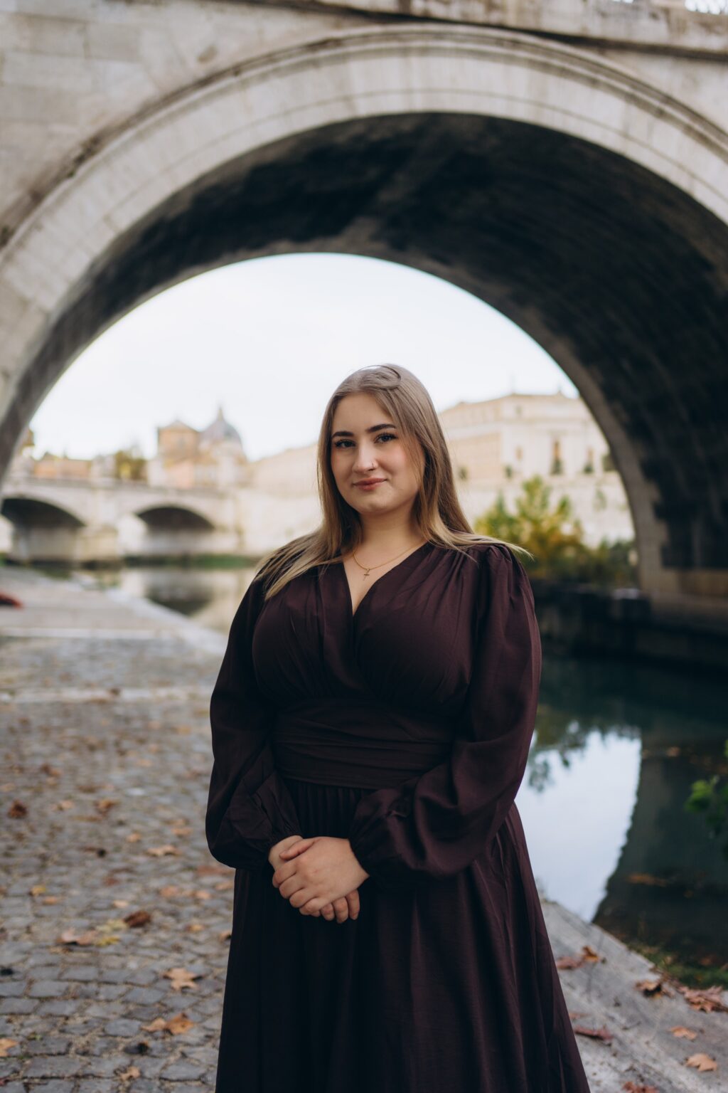 Portrait under a bridge arch on the Tiber embankment