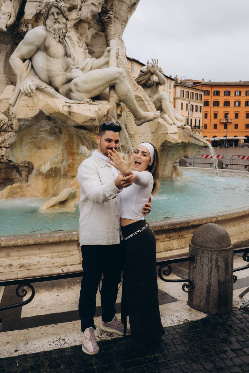 Showing the engagement ring at the Fountain of the Four Rivers, Piazza Navona