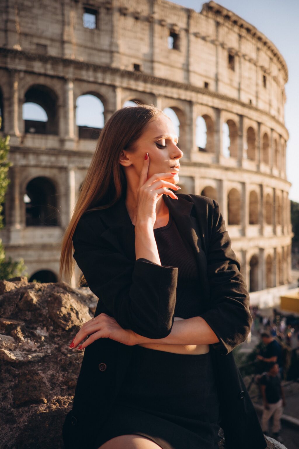 Solo portrait with the Colosseum in golden evening light