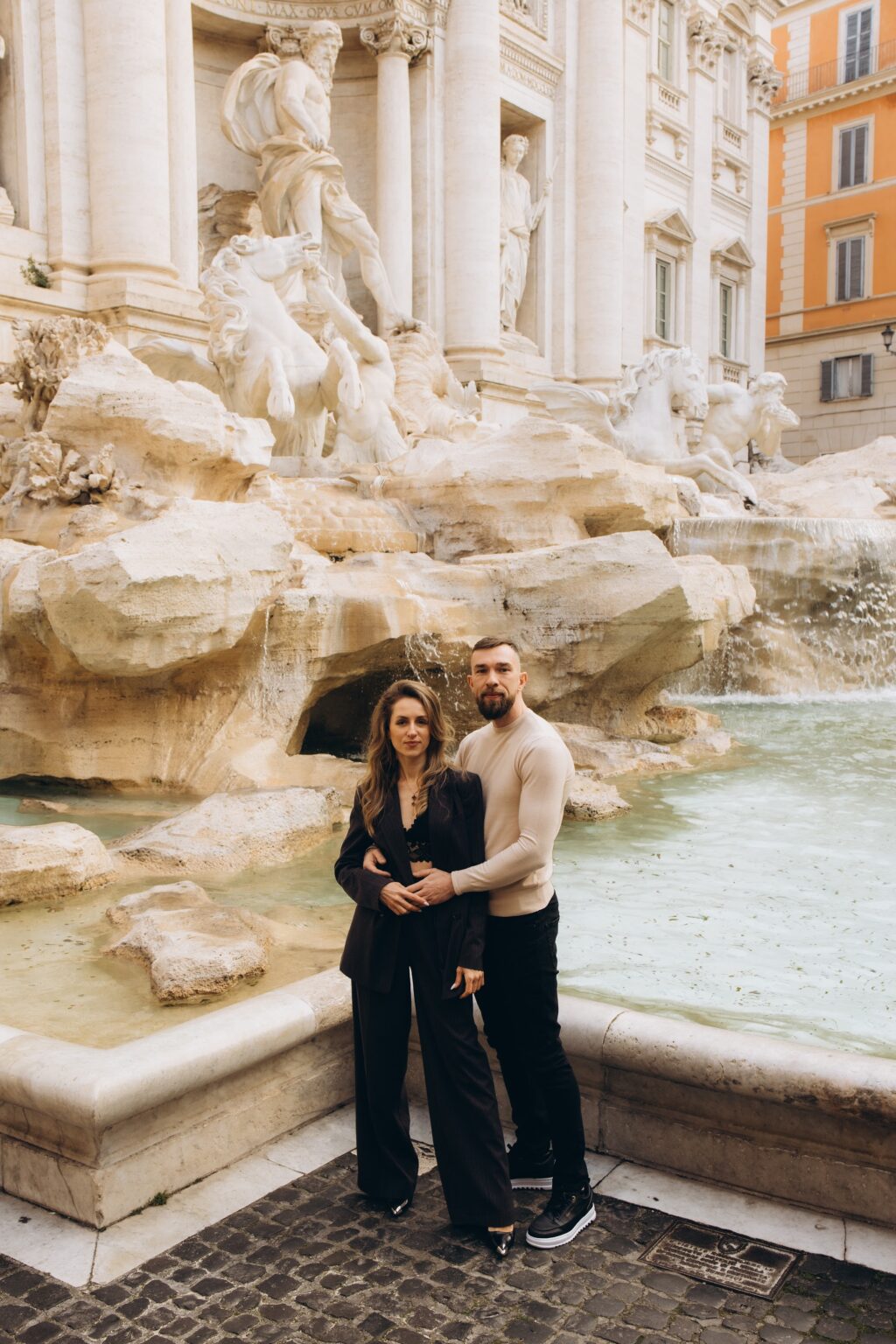 Couple at the Trevi Fountain on a March morning