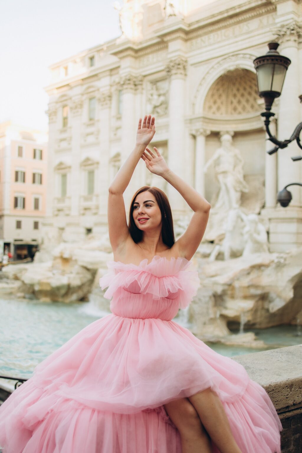 Solo photoshoot in a pink tulle dress at the Trevi Fountain