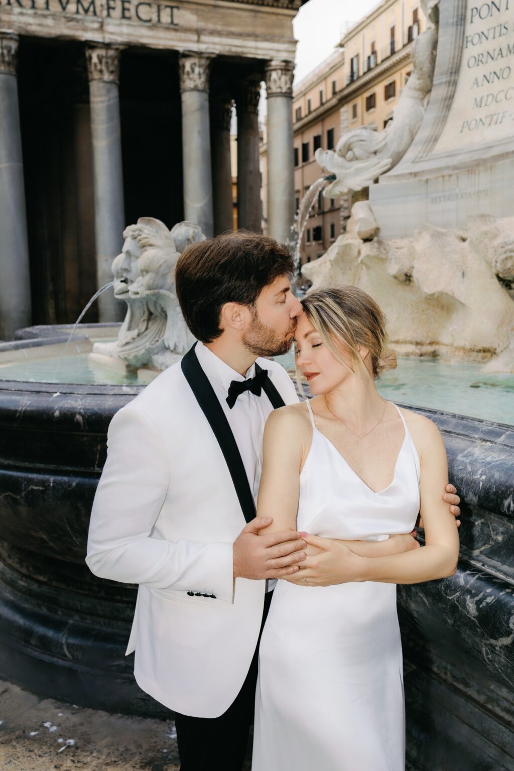Groom dipping the bride in front of the Pantheon
