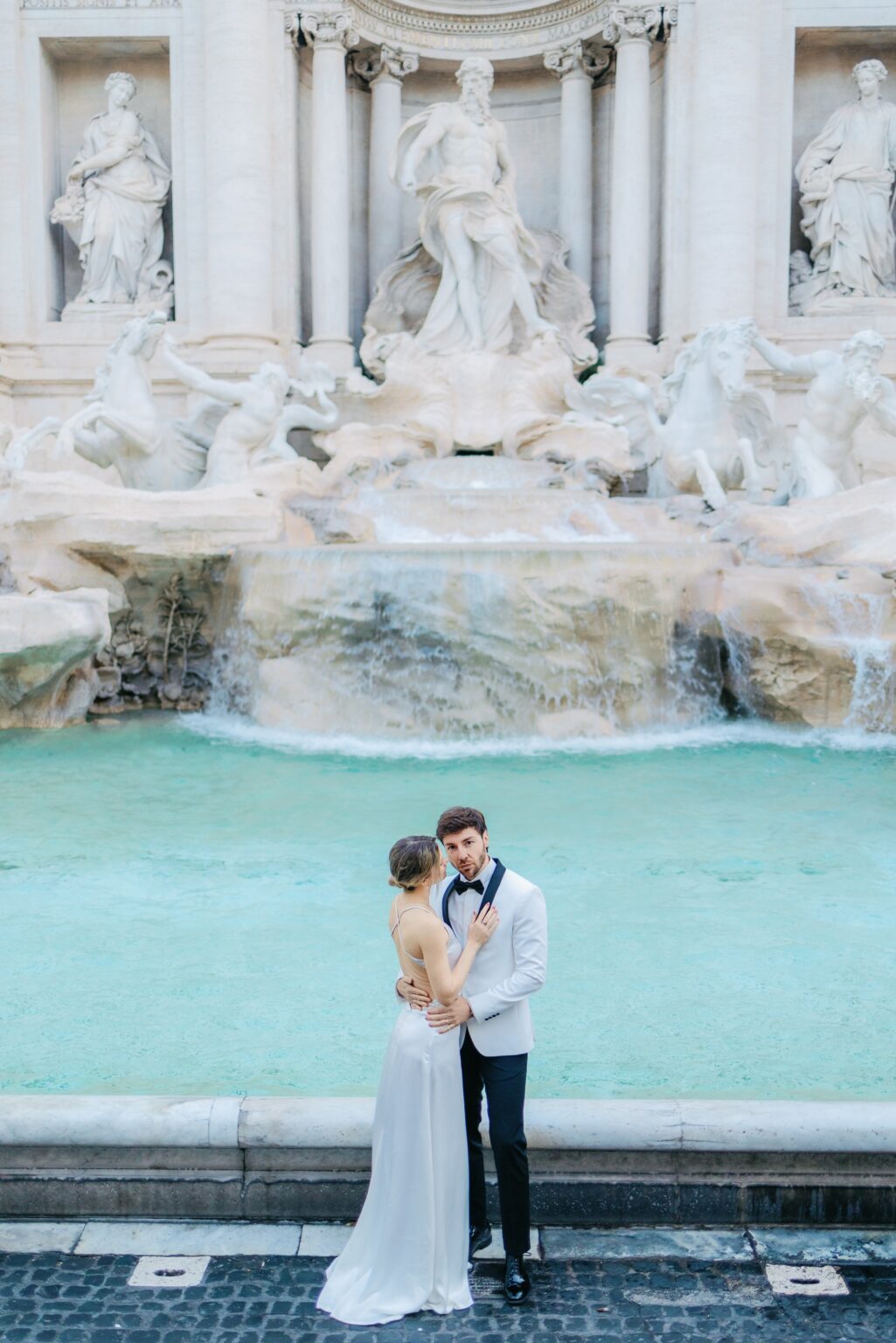 Bride and groom at the Trevi Fountain in Rome